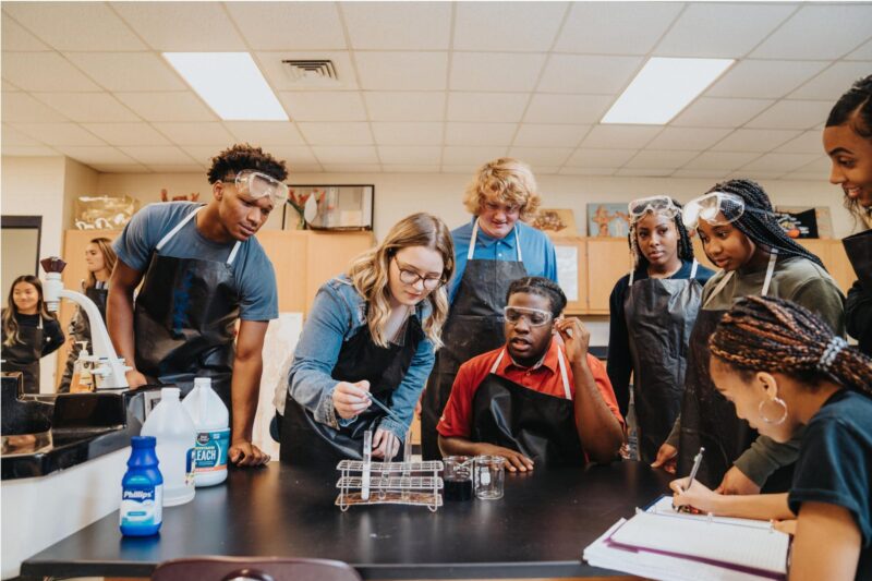 A teacher does an experiment with students in a classroom
