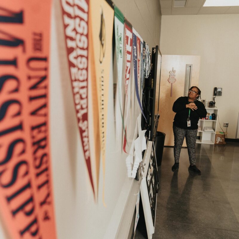 a teacher examines a whiteboard